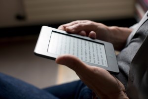 Man using electronics or a KindlePwC_Rep_USA_NYC_JFB_042316_168.jpg